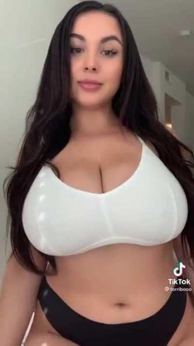 Thot squeezing her big titties together