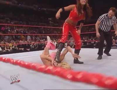 Candice Michelle Grinds Her Boot in Torrie Wilson’s Face