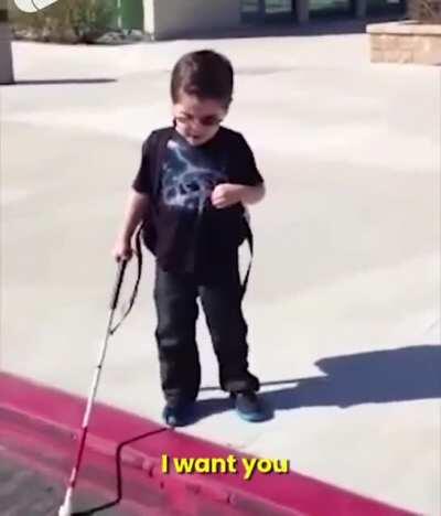 Blind kid experience his first curb by himself while his parents encourage him