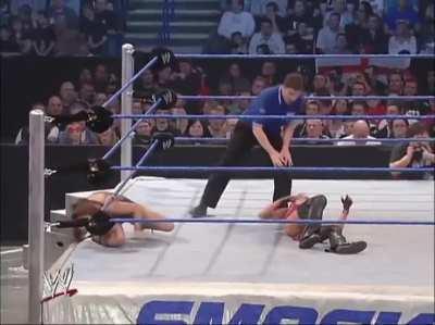 Melina clotheslines Christy and then hits a backbreaker