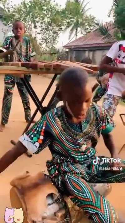 African kids jamming on marimba. Pleasantly trippy!