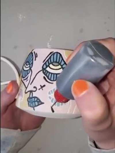 Painting the lines on a mug