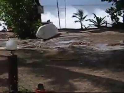 Terrifying footage of tsunami hitting a beach