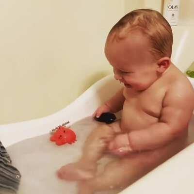 My son, THOROUGHLY enjoying his evening bath...😂