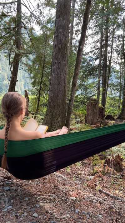 Naked in nature in a hammock with a good book is all I need 