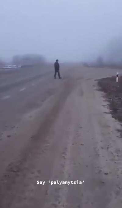 Ukrainian civilian confronts Russian soldiers