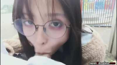 Amateur Japanese Girl With Glasses Deepthroating A Cock In A Park