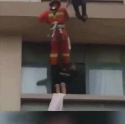 Firefighters saving (by kick) suicidal people.