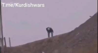 Kurdish fighter withstands a direct headshot. 