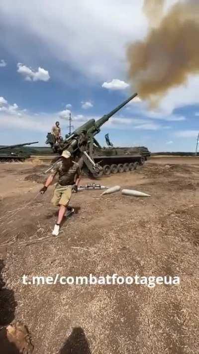 Ukrainian artillerymen fire 203mm 2S7 Peon self-propelled artillery systems at Russian positions in Donetsk region.