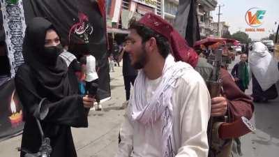 Two Taliban soldiers interviewed and talk about protecting the Shia Ashura festivities.