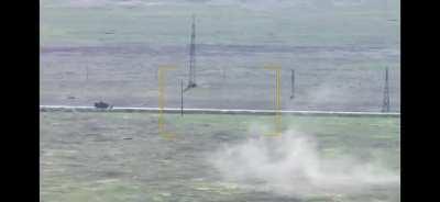 Russian turtle tank under fire by artillery or drones.