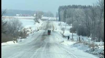 Only in Wisconsin do the Amish ski behind their buddies buggy