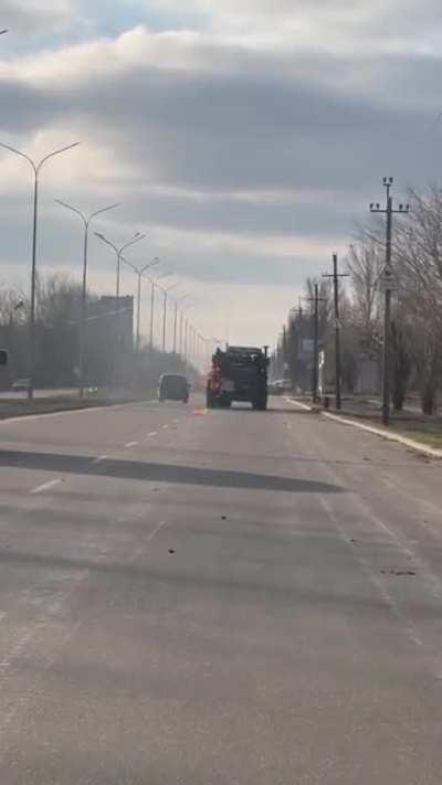 Russian Vehicle being attacked with molotov cocktails from a civilian minivan