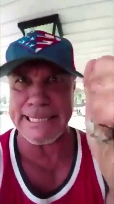 Angry redneck grabs wasp nest with his bare hands and chews it up