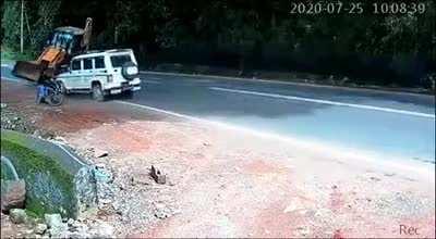 WCGW driving a wheel loader at full speed on a highway