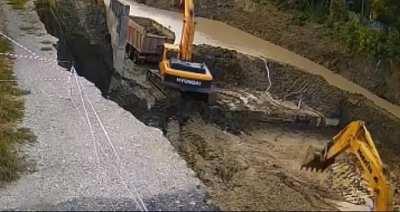 Standing on the edge of construction hole