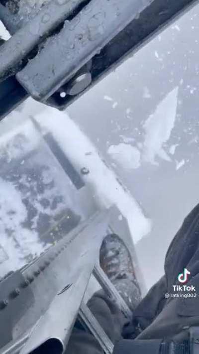 Maintenance trolley running on an aerial tram after some overnight icing.