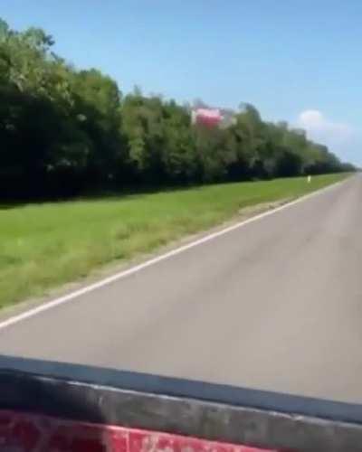 Aerodynamic drag wizardry pulling this plastic bottle behind a pick-up truck