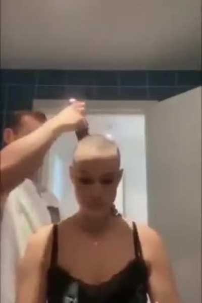 He shaved his head to support her