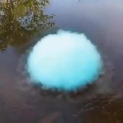 Blowing smoke into soap bubbles