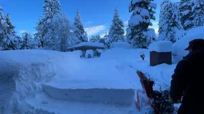 Snowblowing the driveway after a new storm.