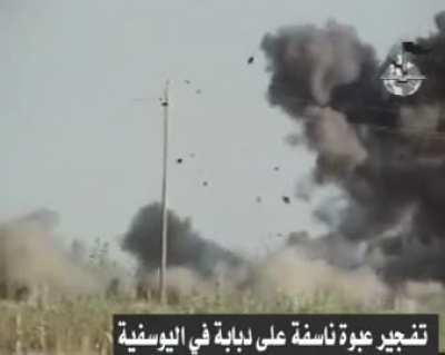 Al Qaeda In Iraq Militants Place an IED by the Side of a Road Which is detonated As an American tank passes (Abrams) in al-Yusefia, 2005 November 10