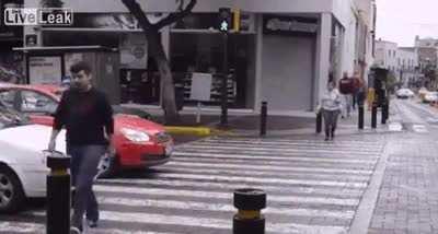 Car blocks pedestrian's path, so pedestrian blocks car's path