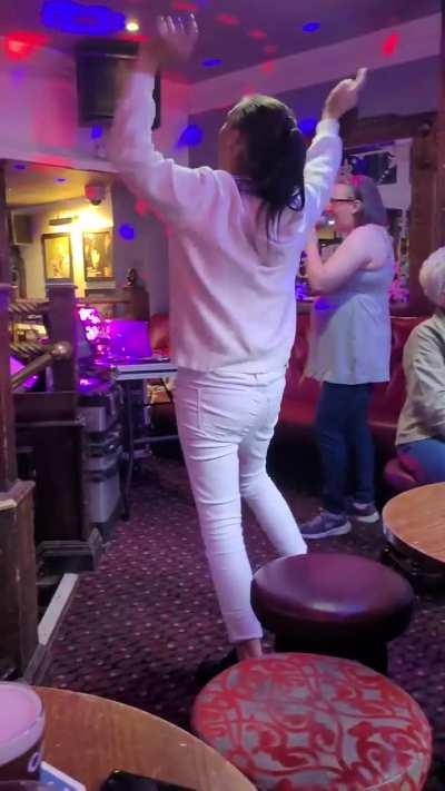 My friend trying to sing karaoke for the first time in years when this woman decided it was her stage.