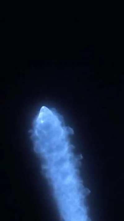 Falcon 9 creating a twilight phenomenon in the night sky.