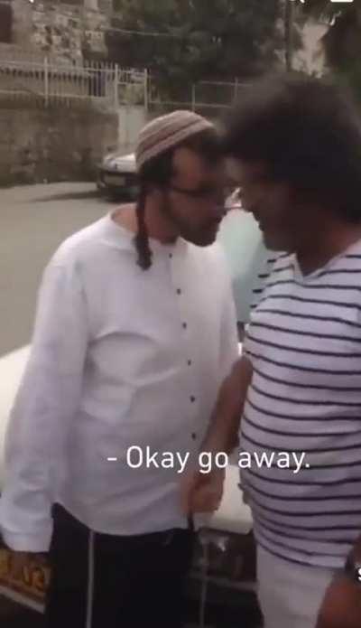 Israeli settler harasses a Palestinian tour guide in occupied East Jerusalem, telling him 'Palestine is finished. It's Bibi in the government.'