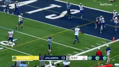 Villanova QB Daniel Smith flicks a pass for a touchdown while being sacked