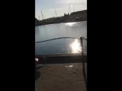 Drunk guy smashes his face trying to jump off a dock