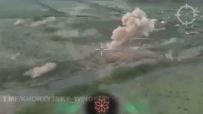 Drone footage of a Russian IFV driving over a mine, continues the path and drives over a bigger mine and explodes.