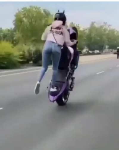 Nice balance. High risk. Purple bike.