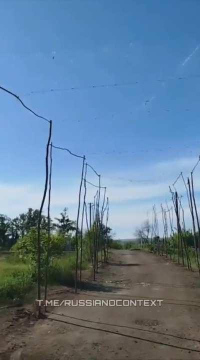 Russian supply road with anti drone nets (fishing nets) 