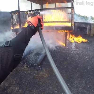 This biker stopped to help put out a fire in his neighbour's backyard