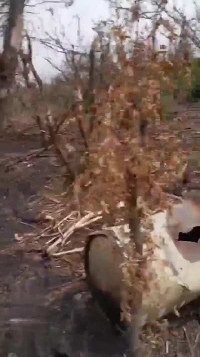 A Russian soldier examines the wreckage of a downed MGM-140A ATACMS cluster missile at his position - Via Karymat Telegram