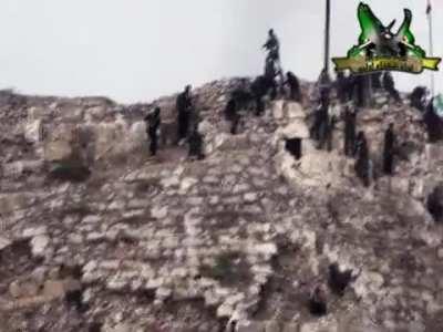 Idlib Martyrs Brigade scale the ruins of a 10th century Byzantine castle to attack the Syrian Army; Harem, Syria Nov 2012