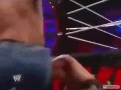 John Cena whips The Miz with his belt