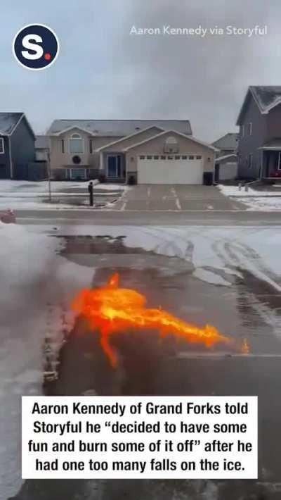 A North Dakota meteorologist captured this video of a small fire whirl forming as he used gasoline to remove ice from his driveway. [OC:- Aaron Kennedy]