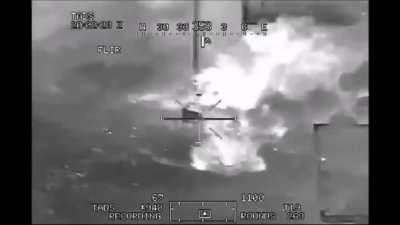 Direct hit on a group of Taliban fighters. A AH-64 Apache fires a AGM-114 Hellfire missile plus a little extra.