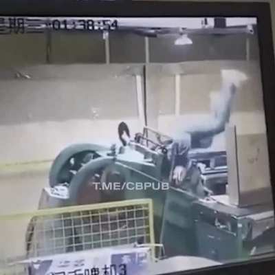 Worker gets caught up in a machine