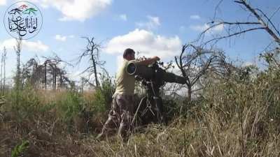 FSA Brigade of the Chargers (today known as 1st Coastal Division) strikes an SAA tank with a TOW missile near the Kfarya village, near Latakia, 11/09/2014