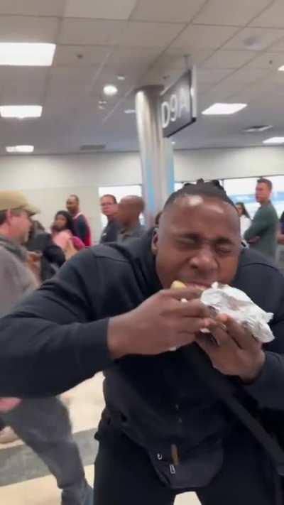 Adult male, screaming “sharkbite”, before eating in the middle of a crowd, at the airport.