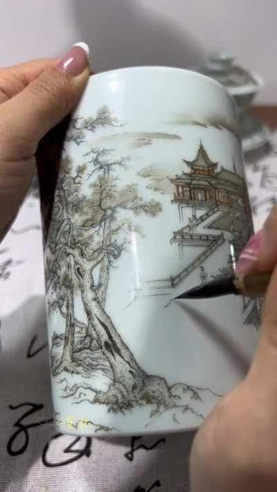 Traditional hand-painted art on a porcelain teacup