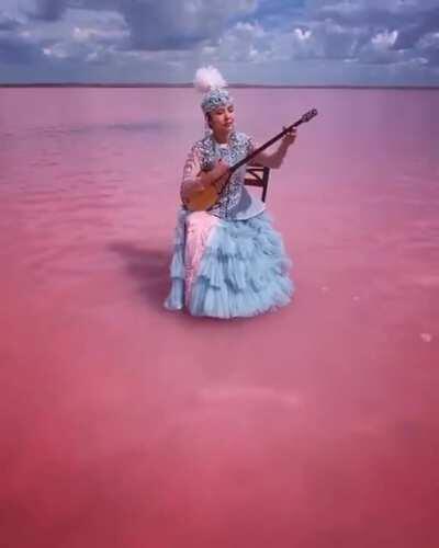 A dombra performance by a 23-year-old Kazakh musician in Lake Köbeituz, a salt lake in Kazakhstan that turns pink every several years.