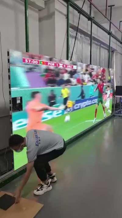 A guy fixing the TV 