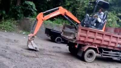 Loading & unloading a mini excavator into a dump truck without a ramp