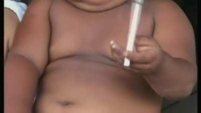 Indonesian Baby addicted to smoking Cigarettes!!!!